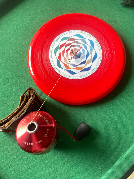 Flying disc fish wheel